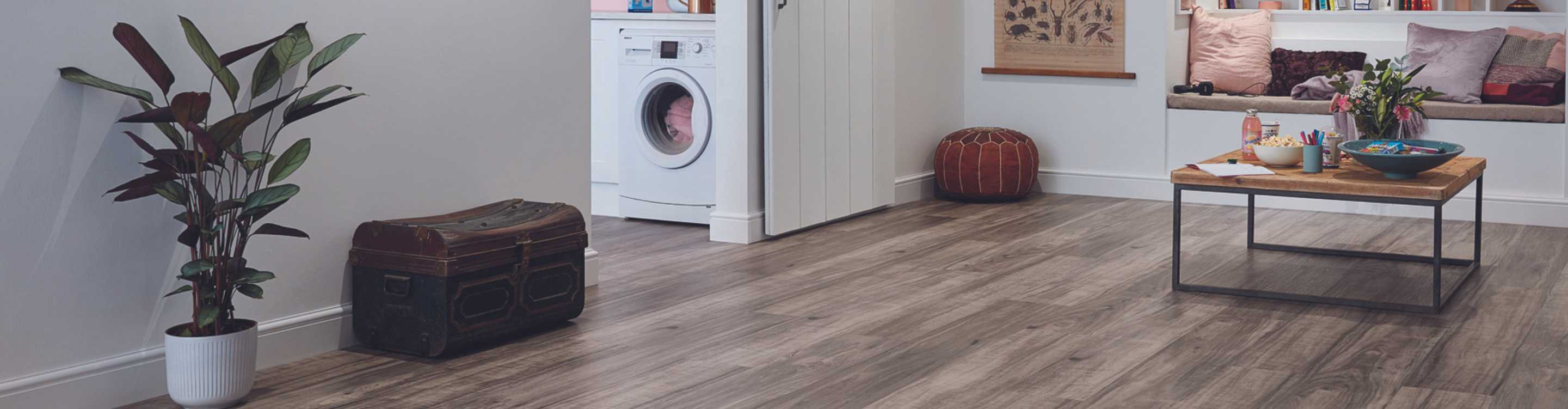 luxury vinyl laundry room flooring in finished basement